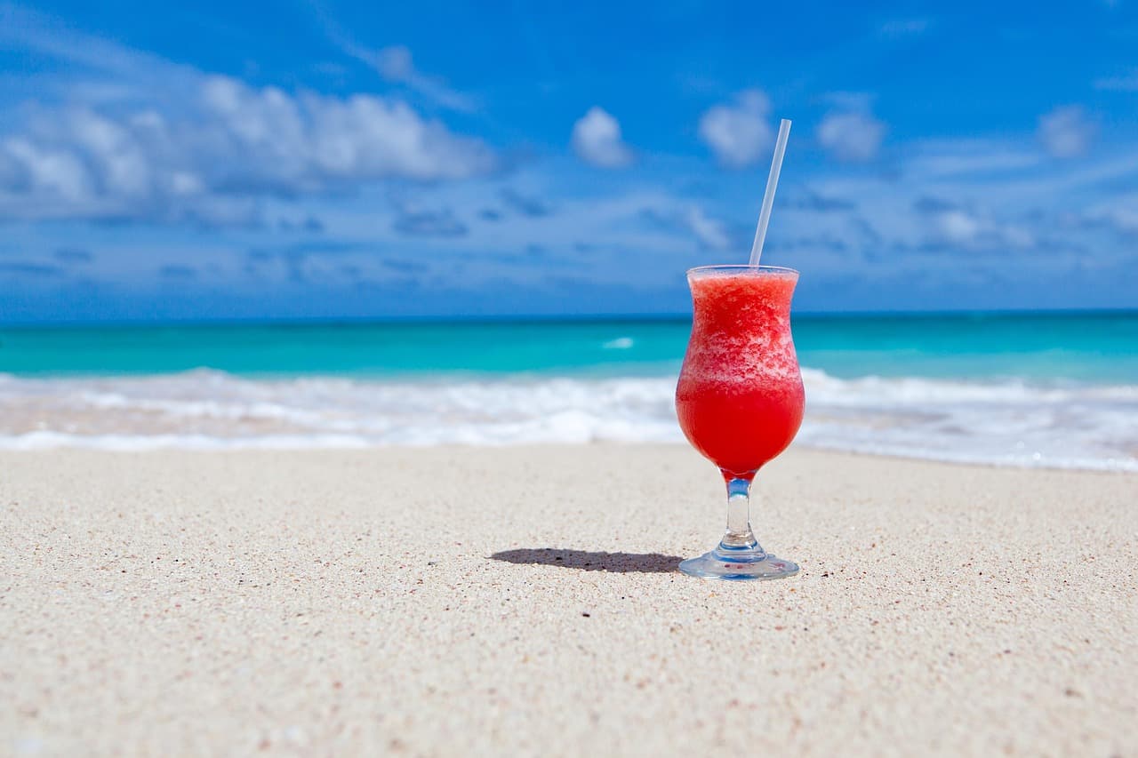 drink, cocktail, beach, beverage, refreshment, alcoholic drink, alcoholic beverage, glass, coast, sand, shore, seashore, paradise, tropical, nature, caribbean sea, caribbean [pid:84533]